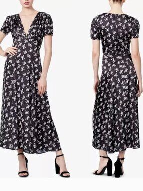 Adorable black dress by Betsey Johnson featuring a signature white bow print 🖤